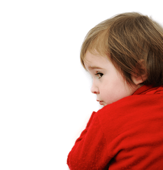 Young child in red shirt looking concerned, illustrating childhood health and allergy risk concepts