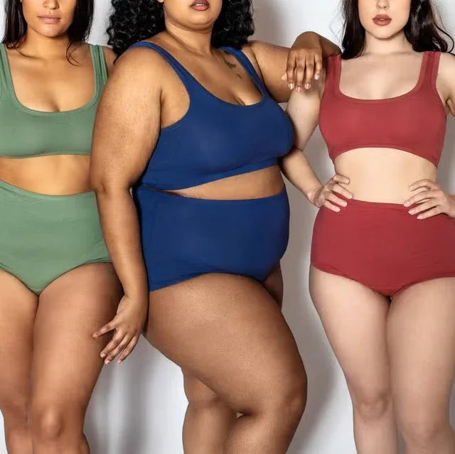 Diverse women modeling high-waisted underwear sets in green, blue, and red